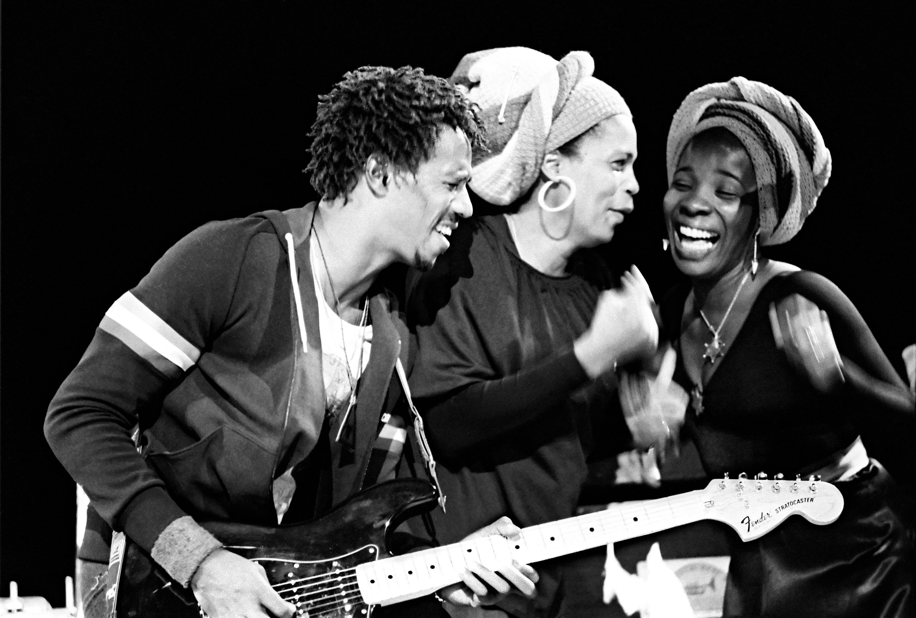 Junior Marvin with Marcia Griffiths and Rita Marley (of the I-Threes), performing with Bob Marley and the Wailers at the Greek Theater, Berkeley, California, on July 21, 1978. Photo by Ed Perlstein/Redferns.